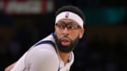Los Angeles Lakers guard Austin Reaves defends Dallas Mavericks forward Anthony Davis.