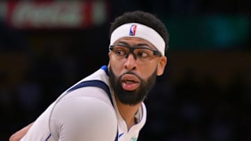 Los Angeles Lakers guard Austin Reaves defends Dallas Mavericks forward Anthony Davis.