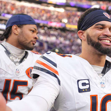 Nov 16, 2025; Minneapolis, Minnesota, USA;  Chicago Bears quarterback Caleb Williams (18) greets a Minnesota Vikings player following a game at U.S. Bank Stadium. Mandatory Credit: Brad Rempel-Imagn Images