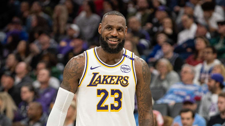 Dec 21, 2024; Sacramento, California, USA; Los Angeles Lakers forward LeBron James (23) smiles after his team scored against the Sacramento Kings during the fourth quarter at Golden 1 Center. Mandatory Credit: Ed Szczepanski-Imagn Images