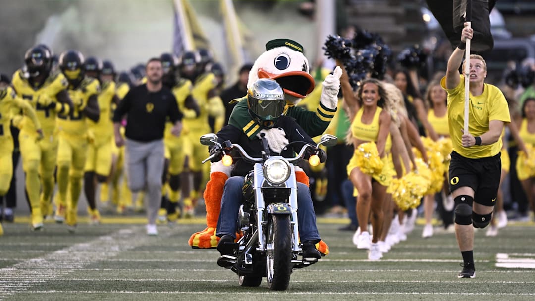 Oct 4, 2024; Eugene, Oregon, USA; The Oregon Ducks mascot rides out to the field on a motorcycle as the football team takes the field before a game against the Michigan State Spartans at Autzen Stadium. Mandatory Credit: Troy Wayrynen-Imagn Images