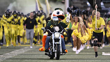 Oct 4, 2024; Eugene, Oregon, USA; The Oregon Ducks mascot rides out to the field on a motorcycle as the football team takes the field before a game against the Michigan State Spartans at Autzen Stadium. Mandatory Credit: Troy Wayrynen-Imagn Images