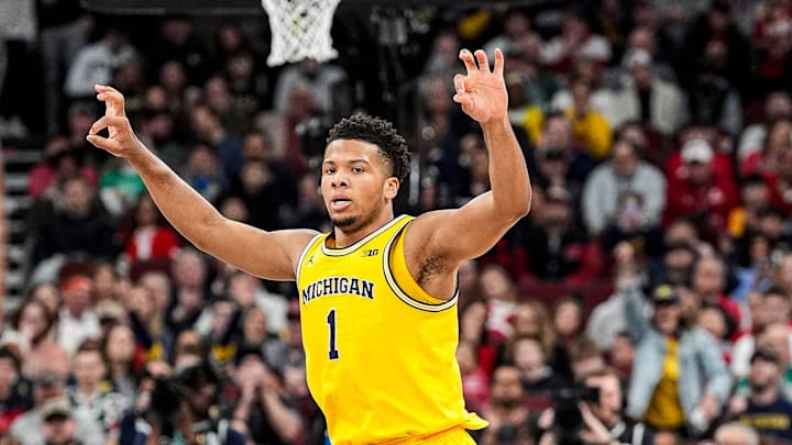 Michigan guard Trey McKenney (1) celebrates a 3-pointer against Wisconsin during the first half of Big Ten Tournament semifinal at United Center in Chicago on Saturday, March 14, 2026.