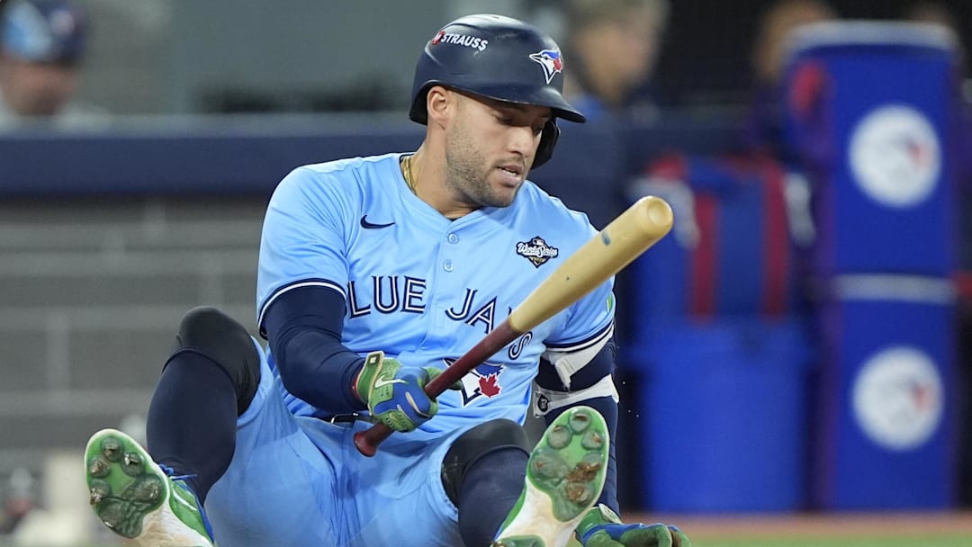 Oct 31, 2025; Toronto, Ontario, CAN; Toronto Blue Jays right fielder George Springer (4) reacts on the ground after avoiding a pitch against the Los Angeles Dodgers in the eighth inning during game six of the 2025 MLB World Series at Rogers Centre. Mandatory Credit: John E. Sokolowski-Imagn Images