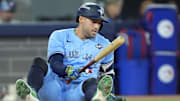 Oct 31, 2025; Toronto, Ontario, CAN; Toronto Blue Jays right fielder George Springer (4) reacts on the ground after avoiding a pitch against the Los Angeles Dodgers in the eighth inning during game six of the 2025 MLB World Series at Rogers Centre. Mandatory Credit: John E. Sokolowski-Imagn Images