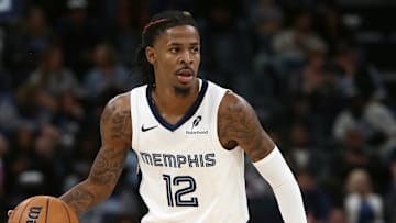 Oct 18, 2024; Memphis, Tennessee, USA; Memphis Grizzlies guard Ja Morant (12) dribbles during the second half against the Miami Heat at FedExForum. Mandatory Credit: Petre Thomas-Imagn Images