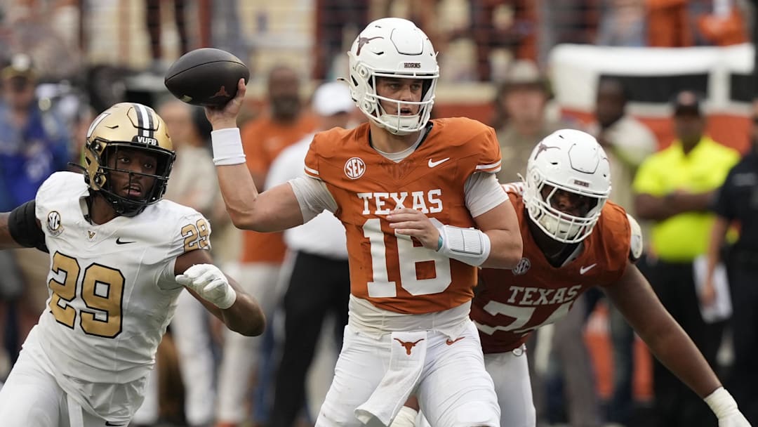Texas Longhorns quarterback Arch Manning passes ahead of Vanderbilt Commodores defensive back Thomas Jones during the second half at Darrell K Royal-Texas Memorial Stadium.
