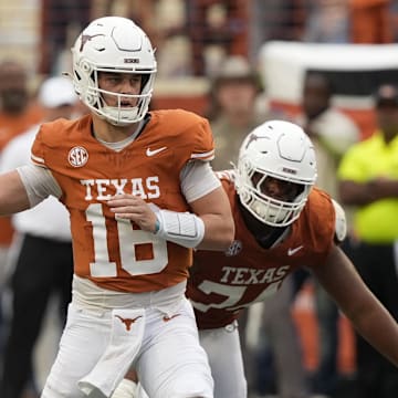 Texas Longhorns quarterback Arch Manning passes ahead of Vanderbilt Commodores defensive back Thomas Jones during the second half at Darrell K Royal-Texas Memorial Stadium.