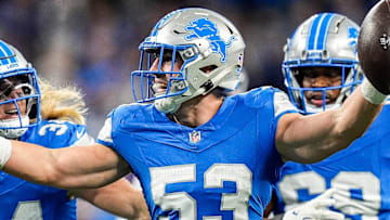 Detroit Lions linebacker Trevor Nowaske (53), center, celebrates an interception against Tennessee Titans during the first half at Ford Field in Detroit on Sunday, Oct. 27, 2024.