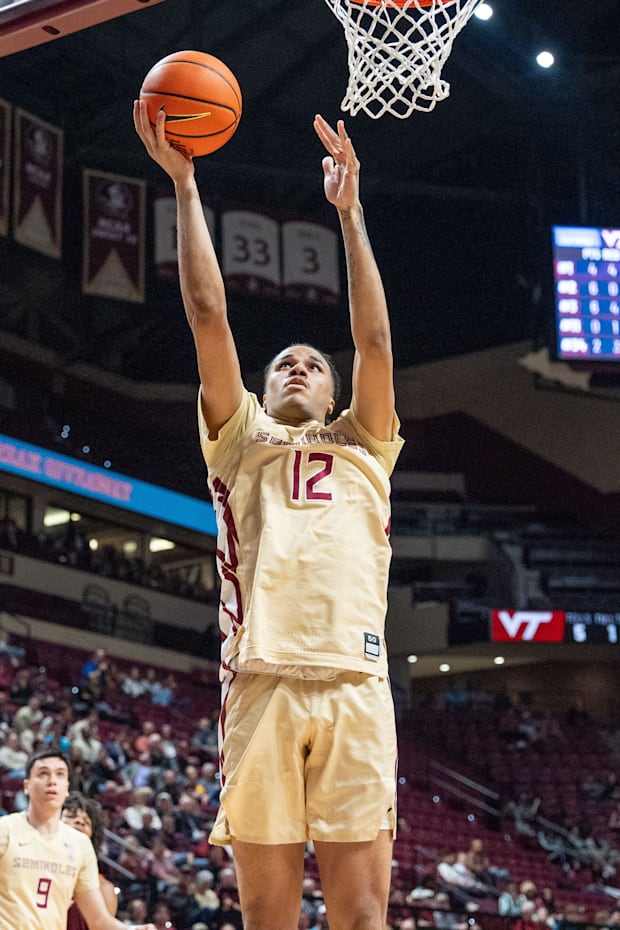 Florida State Seminoles forward Malique Ewin (12) goes in for a layup.