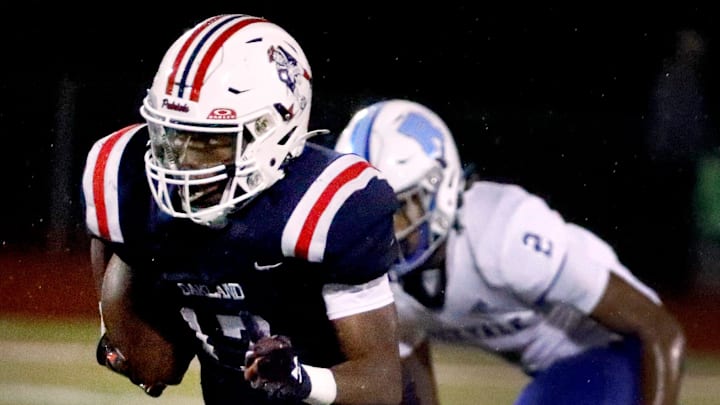 Oakland's Daune Morris (17) carries the ball down the field for a touchdown Rockvale during a football game at Oakland, on Friday, Sept. 27, 2024. Oakland's Daune Morris (17) carries the ball down the field for a touchdown Rockvale during a football game at Oakland, on Friday, Sept. 27, 2024.