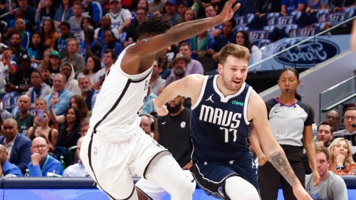 Oct 27, 2023; Dallas, Texas, USA; Dallas Mavericks guard Luka Doncic (77) drives on Brooklyn Nets forward Dorian Finney-Smith (28) during the second quarter at American Airlines Center. Mandatory Credit: Andrew Dieb-USA TODAY Sports