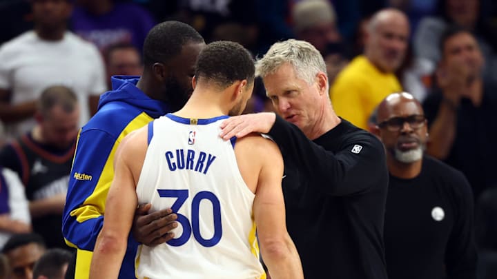 Apr 17, 2026; Phoenix, Arizona, USA; Golden State Warriors guard Stephen Curry (30) with forward Draymond Green and head coach Steve Kerr against the Phoenix Suns during the closing seconds of the play-in rounds of the 2026 NBA Playoffs at Mortgage Matchup Center. Mandatory Credit: Mark J. Rebilas-Imagn Images