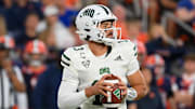 Aug 31, 2024; Syracuse, New York, USA; Ohio Bobcats quarterback Parker Navarro (13) drops back to pass against the Syracuse Orange during the second half at the JMA Wireless Dome. Mandatory Credit: Rich Barnes-Imagn Images