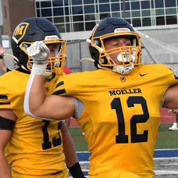 Tyler Josleyn (12) celebrates scoring a touchdown for Moeller as the Crusaders top Princeton 41-20 at the King of the Block rivalry football game, Aug. 23, 2025.