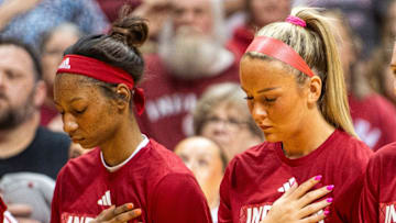 Indiana's Chloe Moore-McNeil (22) and Syndey Parrish (33) during the National Anthem before the Indiana versus Maryland women's basketball game at Simon Skjodt Assembly Hall on Thursday, Feb. 27, 2025.