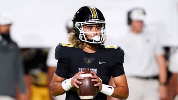 Oct 20, 2023; Carrollton, GA, USA; Carrollton Trojans quarterback Julian Lewis (10) drops back to pass against the Westlake Lions during the first half at Grisham Stadium. The 15-year-old Carrollton High student has already committed to playing for the University of Southern California Trojans and has been considered one of the top high school quarterback prospects. Mandatory Credit: John David Mercer-USA TODAY Sports