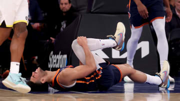 Jan 30, 2024; New York, New York, USA; New York Knicks guard Quentin Grimes (6) grabs his right leg