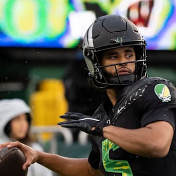 Oregon quarterback Dante Moore throws a pass before the game as the Oregon Ducks host the Wisconsin Badgers on Oct. 25, 2025, at Autzen Stadium in Eugene, Oregon.