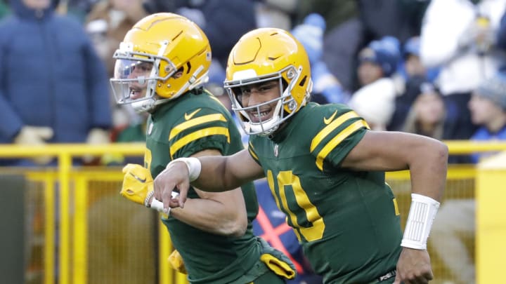 Jordan Love and Christian Watson celebrate a Packers touchdown vs. the Chargers.