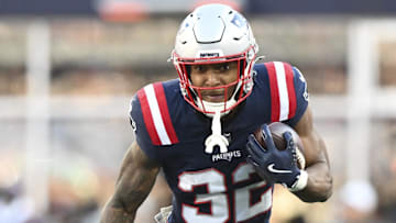 Nov 2, 2025; Foxborough, Massachusetts, USA;  New England Patriots running back TreVeyon Henderson (32) runs the ball against the Atlanta Falcons during the third quarter at Gillette Stadium. 
