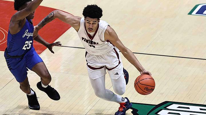 Princeton's Kam Mercer (4) drives to the basket against Hilliard Bradley's Jordan Reed-Davis during their OHSAA DI state championship game Sunday, March 22, 2026.
