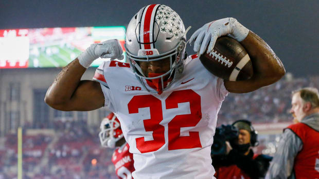 Ohio State Buckeyes running back TreVeyon Henderson celebrates a touchdown during a college football game in the Big Ten.