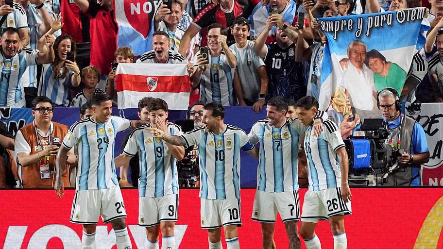Lionel Messi celebrates with teammates