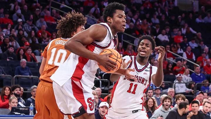 Oct 25, 2026; New York, NY, USA;  St. John's Red Storm center Theo Edema (23) grabs a rebound away from Texas Longhorns guard Austin Goosby (10) in the second half at Madison Square Garden.