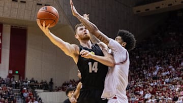 Nov 16, 2023; Bloomington, Indiana, USA; Wright State Raiders forward Brandon Noel (14) shoots the ball while  Indiana Hoosiers center Kel'el Ware (1) defends in the second half at Simon Skjodt Assembly Hall. Mandatory Credit: Trevor Ruszkowski-Imagn Images
