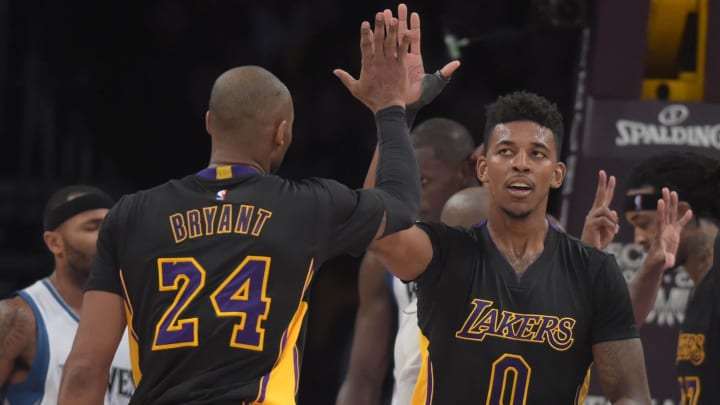 Nov 28, 2014; Los Angeles, CA, USA; Los Angeles Lakers guards Kobe Bryant (24) and Nick Young (0)