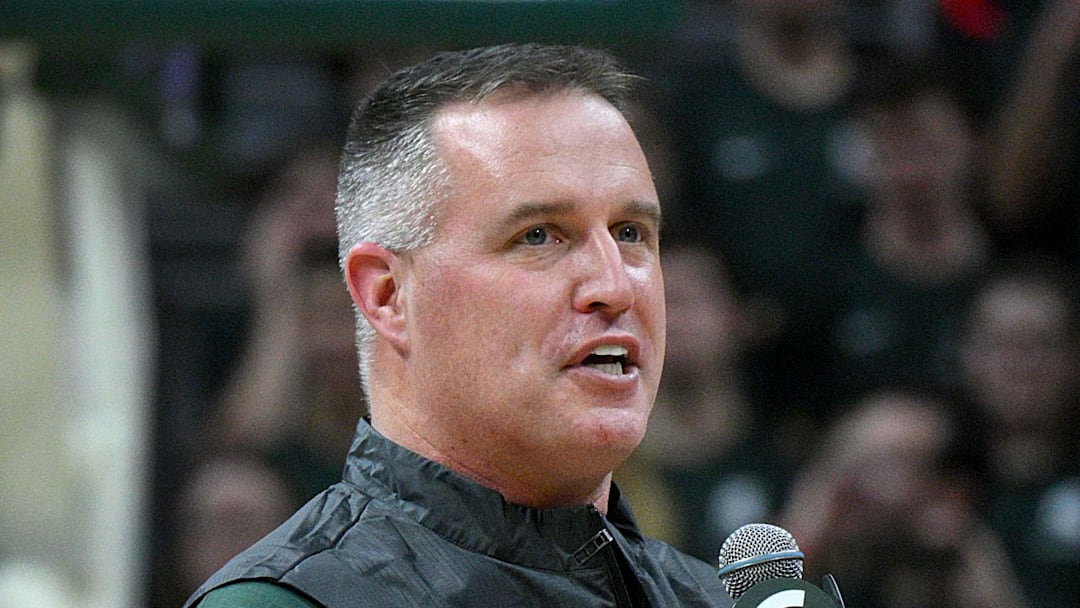 Dec 2, 2025; East Lansing, Michigan, USA;  Michigan State head football coach Pat Fitzgerald watches the Spartans defeat the Iowa Hawkeyes at Jack Breslin Student Events Center. Mandatory Credit: Dale Young-Imagn Images
