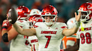 Louisville Cardinals quarterback Miller Moss (7) celebrates after winning the game against the Miami Hurricanes at Hard Rock Stadium. Credit: Sam Navarro-Imagn Images