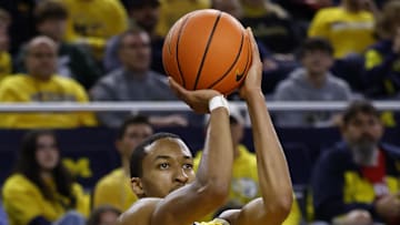 Dec 29, 2024; Ann Arbor, Michigan, USA;  Michigan Wolverines guard Nimari Burnett (4) shoots in the first half against the Western Kentucky Hilltoppers at Crisler Center. Mandatory Credit: Rick Osentoski-Imagn Images
