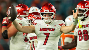 Oct 17, 2025; Miami Gardens, Florida, USA; Louisville Cardinals quarterback Miller Moss (7) celebrates after winning the game against the Miami Hurricanes at Hard Rock Stadium. Mandatory Credit: Sam Navarro-Imagn Images