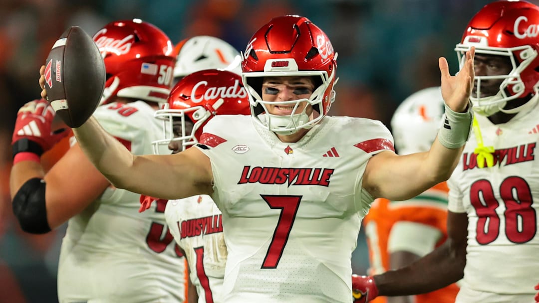 Oct 17, 2025; Miami Gardens, Florida, USA; Louisville Cardinals quarterback Miller Moss (7) celebrates after winning the game against the Miami Hurricanes at Hard Rock Stadium. Mandatory Credit: Sam Navarro-Imagn Images