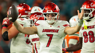 Oct 17, 2025; Miami Gardens, Florida, USA; Louisville Cardinals quarterback Miller Moss (7) celebrates after winning the game against the Miami Hurricanes at Hard Rock Stadium. Mandatory Credit: Sam Navarro-Imagn Images