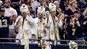 Nov 17, 2024; New Orleans, Louisiana, USA;  New Orleans Saints fans celebrate a touchdown by tight end Taysom Hill (7) against the Cleveland Browns during the second half at Caesars Superdome. Mandatory Credit: Stephen Lew-Imagn Images