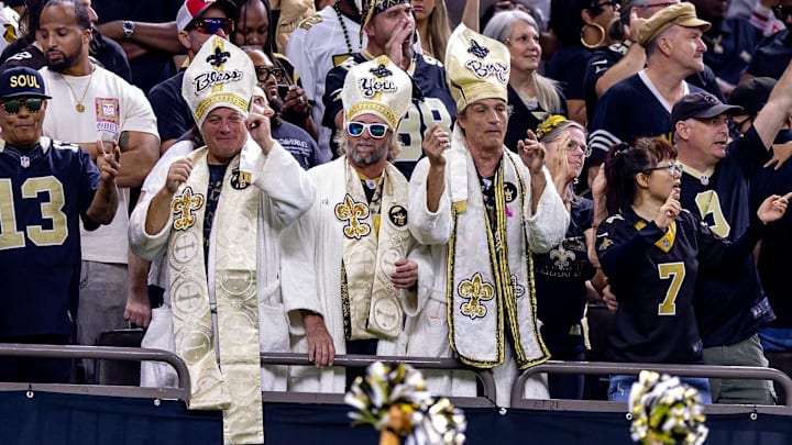 Nov 17, 2024; New Orleans, Louisiana, USA; New Orleans Saints fans celebrate a touchdown by tight end Taysom Hill (7) against the Cleveland Browns during the second half at Caesars Superdome. Mandatory Credit: Stephen Lew-Imagn Images Nov 17, 2024; New Orleans, Louisiana, USA; New Orleans Saints fans celebrate a touchdown by tight end Taysom Hill (7) against the Cleveland Browns during the second half at Caesars Superdome. Mandatory Credit: Stephen Lew-Imagn Images