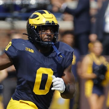 Sep 14, 2024; Ann Arbor, Michigan, USA;  Michigan Wolverines defensive end Josaiah Stewart (0) pursues a play on defense against the Arkansas State Red Wolves at Michigan Stadium. Mandatory Credit: Rick Osentoski-Imagn Images
