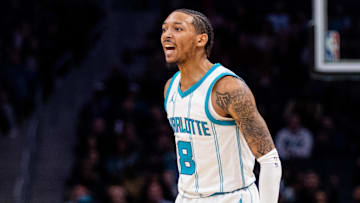Mar 7, 2025; Charlotte, North Carolina, USA; Charlotte Hornets guard Nick Smith Jr. (8) celebrates against the Cleveland Cavaliers during the second quarter at Spectrum Center. Mandatory Credit: Scott Kinser-Imagn Images