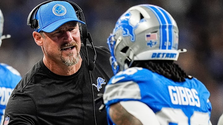 Detroit Lions head coach Dan Campbell shakes hands with running back Jahmyr Gibbs (26) after Sam LaPorta's touchdown against Tennessee Titans during the first half at Ford Field in Detroit on Sunday, Oct. 27, 2024.