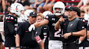 Cincinnati Bearcats head coach Scott Satterfield speaks with players during a NCAA men’s college football game between the Cincinnati Bearcats and Northwestern State Demons, Saturday, Sept. 13, 2025, at Nippert Stadium in Cincinnati.