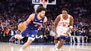 Apr 29, 2025; New York, New York, USA; Detroit Pistons guard Cade Cunningham (2) drives past New York Knicks forward OG Anunoby (8) in the second quarter during game five of first round for the 2025 NBA Playoffs at Madison Square Garden. Mandatory Credit: Wendell Cruz-Imagn Images