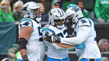 Dec 8, 2024; Philadelphia, Pennsylvania, USA; Carolina Panthers tight end Tommy Tremble (82) celebrates his touchdown catch with guard Robert Hunt (50) and offensive tackle Ikem Ekwonu (79) during the second quarter against the Philadelphia Eagles at Lincoln Financial Field.