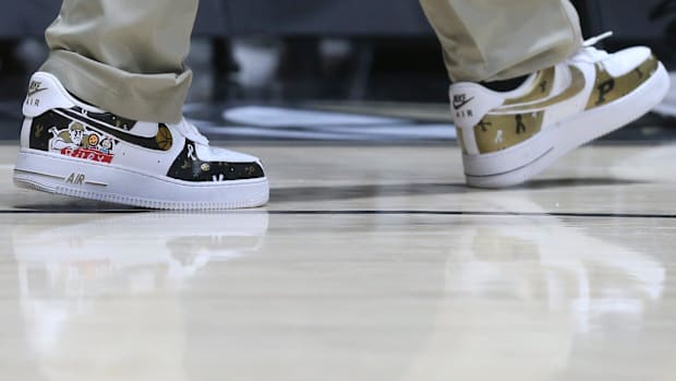 Purdue Boilermakers head coach Matt Painter wears shoes designed by Alexa Wood from Riley Children’s Foundation 