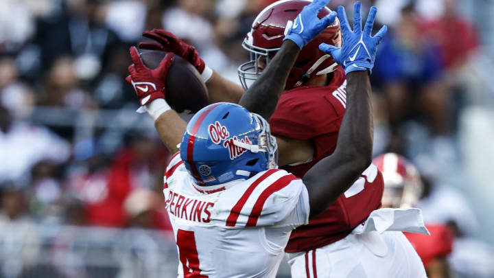 Sep 23, 2023; Tuscaloosa, Alabama, USA; Alabama Crimson Tide tight end Robbie Ouzts (45) catches a pass as Mississippi Rebels linebacker Suntarine Perkins (4) defends during the second half of a football game at Bryant-Denny Stadium. Mandatory Credit: Butch Dill-USA TODAY Sports