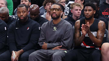 Oct 29, 2025; Salt Lake City, Utah, USA; Portland Trail Blazers guard Damian Lillard (middle) looks on from the bench against the Utah Jazz during the second quarter at Delta Center. Mandatory Credit: Rob Gray-Imagn Images