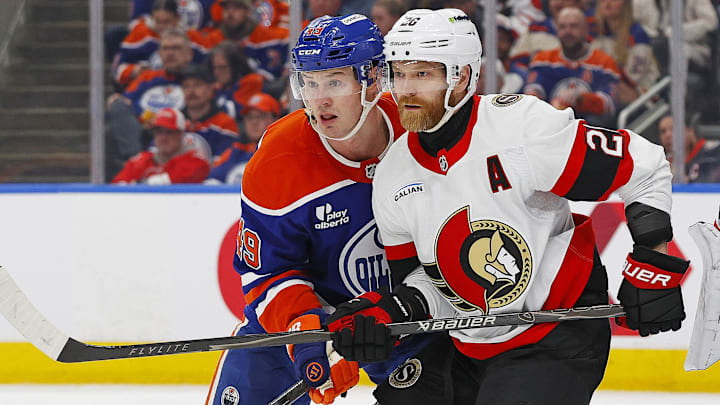 Mar 3, 2026; Edmonton, Alberta, CAN; Ottawa Senators forward Claude Giroux (28) and Edmonton Oilers defensemen Ty Emberson (49) battles for position during the second period at Rogers Place. 