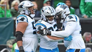 Carolina Panthers tight end Tommy Tremble (82) celebrates his touchdown catch with guard Robert Hunt (50) and offensive tackle Ikem Ekwonu (79) at Lincoln Financial Field.